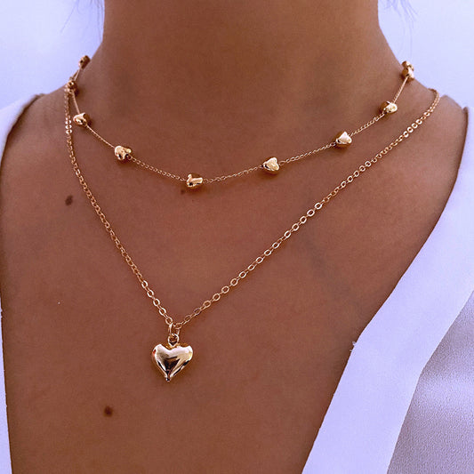 Double layer heart pendant necklace worn on neck